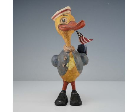 Whimsical hand painted duck dressed in a sailor jacket and sailor hat, featuring vibrant red and white stripes along the hat'