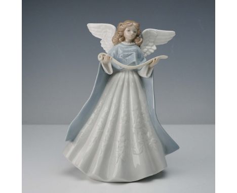 Depicts a serene angel holding a music scroll. Rendered in a glossy finish, the figure is adorned with a flowing white gown f