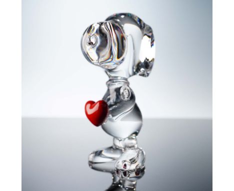 This Baccarat crystal figurine captures Snoopy, the beloved Peanuts character, rendered in brilliant clear crystal while hold