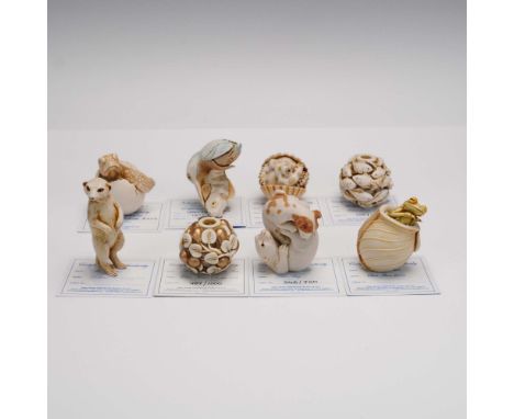This 8 piece lot showcases a captivating selection of resin animal figurines, each marked or signed, and accompanied by Certi