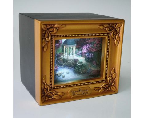 This illuminated collectible diorama by Thomas Kinkade, titled Pools of Serenity, comes from the Gallery of Light series and 