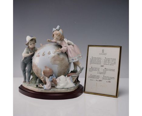 Limited edition, glazed porcelain figure of three children surrounding a large globe with the three boats from the Columbus v