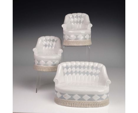 This charming 3-piece Lladro porcelain set features miniature furniture in the form of a tufted couch (PP116) and two matchin