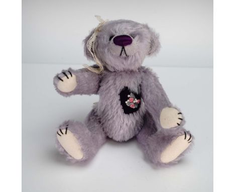 This charming Deb Canham artist-designed bear named Violet is a delightful collectible, handmade in a limited edition of just