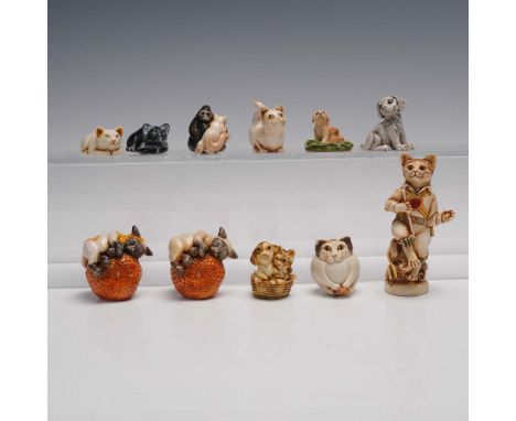 A delightful 11 piece collection of assorted animal figurines, highlighted by Adam Binder Editions' "Ebony &amp; Ivory" cat d