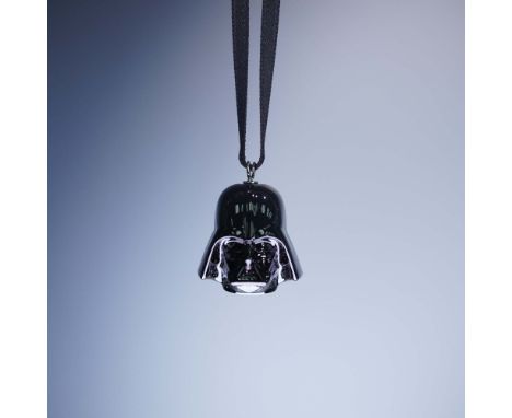 This limited edition Swarovski Darth Vader ornament from the Star Wars collection showcases the iconic Sith Lord rendered in 