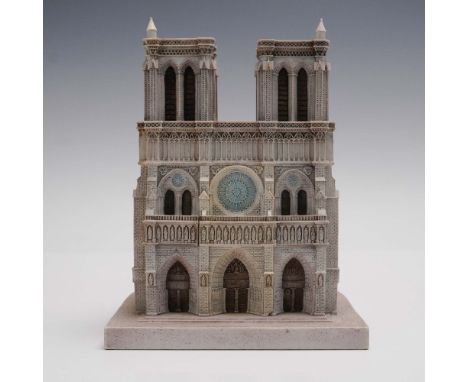 This intricately detailed architectural sculpture  depicts the world renowned Notre Dame Cathedral, a masterpiece of French G