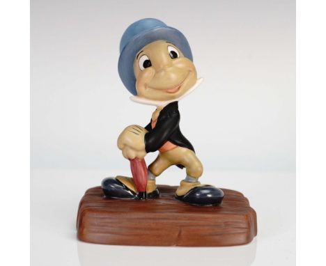 This charming Walt Disney Classics Collection figurine features Jiminy Cricket, the beloved conscience from Pinocchio, in a c