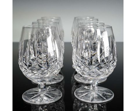 Featuring Waterford's famed Lismore pattern of interlocking diamond and wedge cuts, these eight small brandy glasses sparkle 
