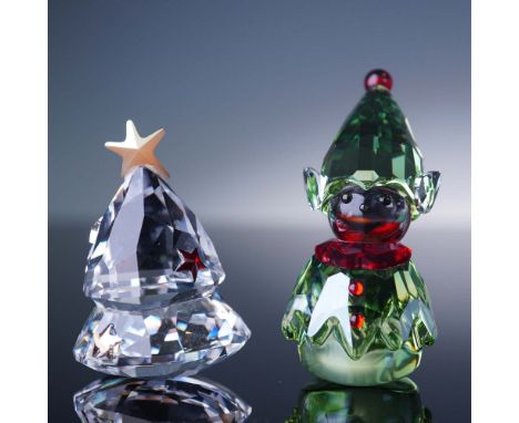 This festive 2-piece Swarovski set features the Rocking Christmas Tree and Santa's Helper figurines. The Rocking Tree is craf