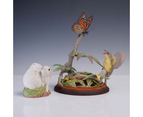 This detailed Boehm porcelain sculpture captures a charming nature scene featuring a bright yellow Fledgling Canada Warbler i