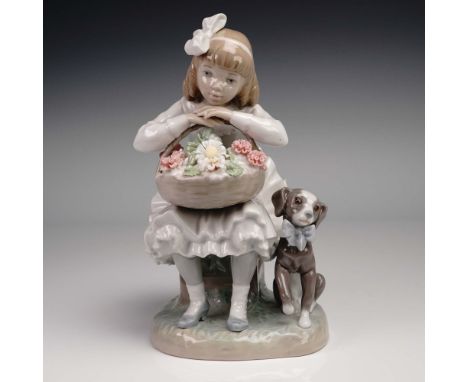 This delightful porcelain figurine by Lladro, model 1001088, captures a tender moment between a young girl and her loyal pup.