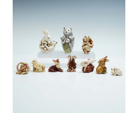 A beautifully composed 10 piece animal figurine lot featuring playful and affectionate woodland and forest creatures includin