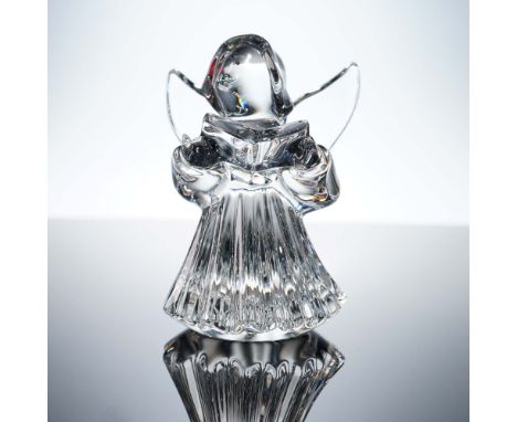This exquisite Baccarat crystal figurine features a serene angel in a flowing, fluted robe, holding an open songbook in grace