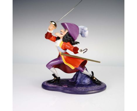 This vibrant Walt Disney Classics Collection figurine captures the flamboyant villain Captain Hook in a dramatic pose, sword 