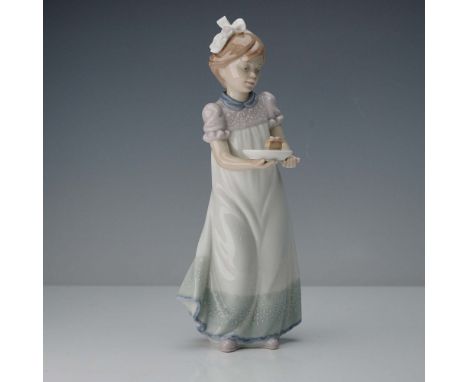 This glossy figure depicts a young girl holding a piece of cake on a plate. The figurine features a white dress with a delica