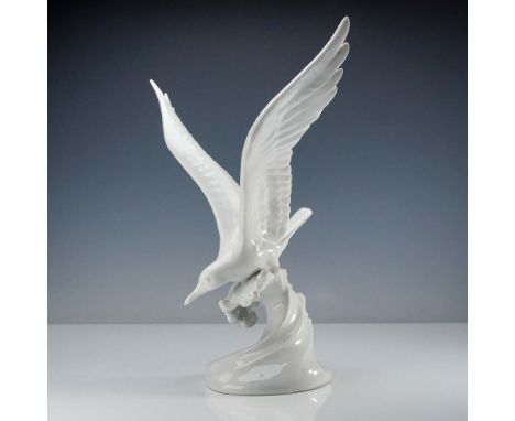 Produced by Herend, the renowned Hungarian porcelain manufacturer known for its hand-crafted and high-gloss figurines, this d
