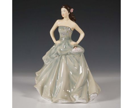 This exquisite Royal Doulton figurine, Happy Birthday 2013 (HN5587), is a beautifully hand-decorated bone china piece. Design