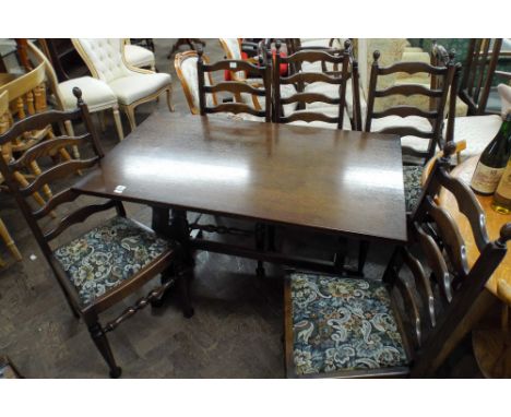 Four foot reproduction oak refectory style dining table together with 6 oak ladder back chairs with tapestry upholstered seat