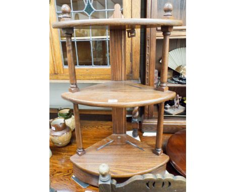 An Ercol oak three tier corner what not approx 70cms tall 