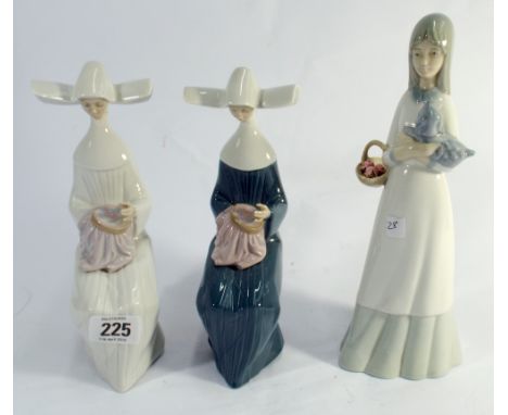 Two Lladro figurines of seated nuns embroidering along with another similar figure 