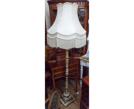 An onyx and brass standard lamp with cream tasseled shade 