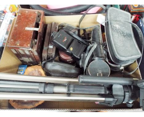 A Praktica camera, an old slide camera, tri-pod, quantity of lenses etc  