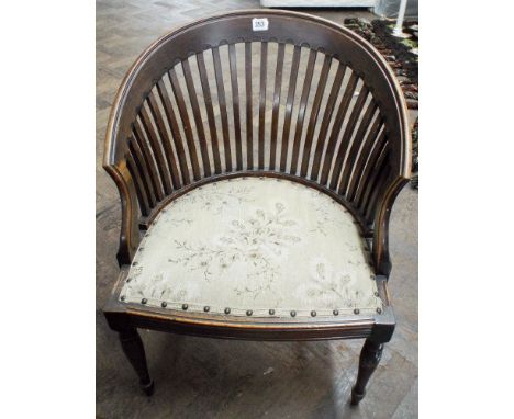 An Edwardian comb back tub shaped occasional chair with tapestry seat 