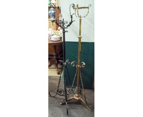 A brass standard lamp and a wrought iron lamp