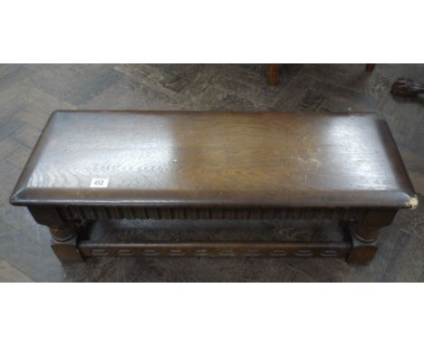 A reproduction long oak stool 