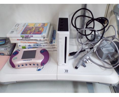 A Wii machine with accessories, a Leapster II games, three Gameboy's and a camera  