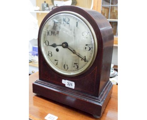 A 1920's mahogany cased arched dial mantle clock 