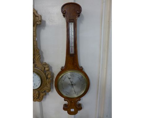 A Victorian walnut banjo barometer, the silvered dial signed Gray, Market Place, Leicester