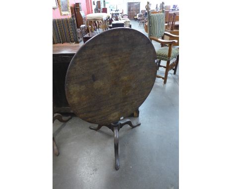 A George III mahogany circular tilt top tripod table