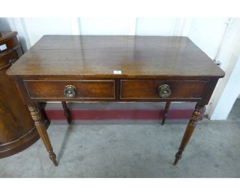 A late Georgian mahogany side table with two frieze drawers on ring turned supports, 91cm wide