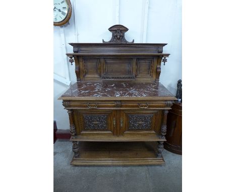 A 19th Century French Henry II style walnut and marble topped buffet