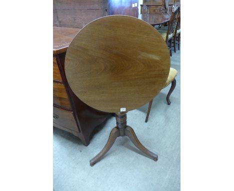 A Victorian mahogany tilt top tripod table with circular top