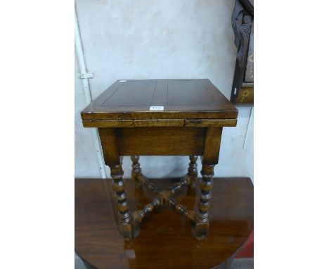 A miniature oak draw-leaf table