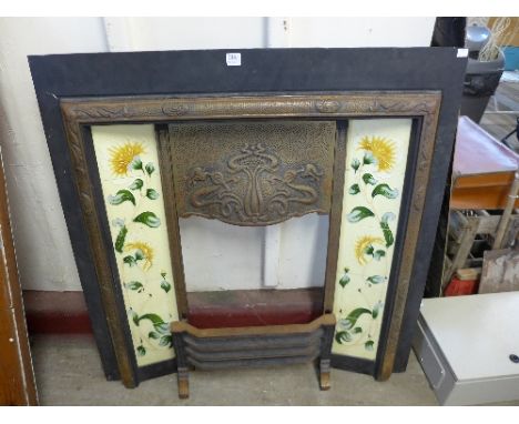 An Art Nouveau style cast iron fire surround