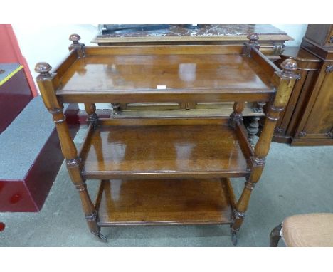 A 19th Century mahogany three tier buffet each tier with three quarter gallery and baluster turned columns, 88cm wide, 110cm 