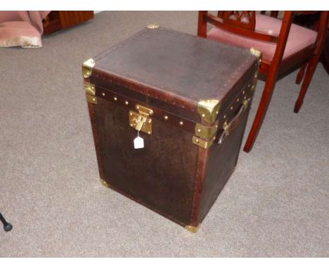 As new brown leather and metal bound trunk
