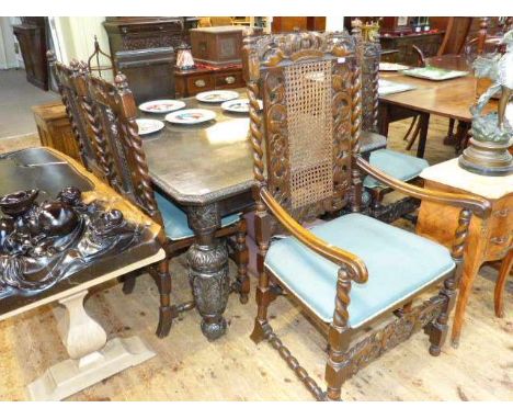 Victorian carved oak extending dining table and two leaves together with five carved oak and bergere panel back dining chairs