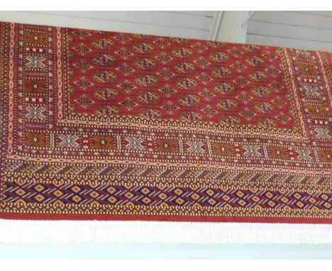 Red ground Bokhara carpet 2.30 x 1.60