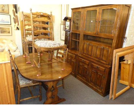 James Lupton & Sons Ltd oak cocktail wall unit, oval extending dining table and four ladder back dining chairs