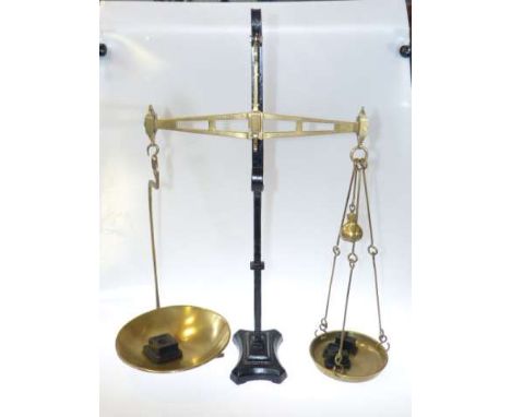 Pair of cast iron and brass balance scales and weights