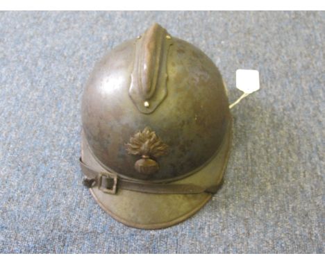 WW1 French Adrian Pattern helmet with most of its original blue paint finish lining and chin strap  