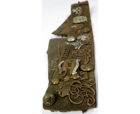 Cap badges titles and buttons mounted on old army belt (qty)