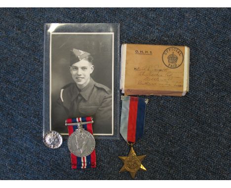 POW 1939-45 Star and War medal in box with Kings discharge badge in box with portrait photo to 1069376 Dvr A E Smyth RA captu