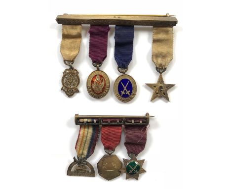 Masonic Miniature Jewels, Medals Mounted as worn. Comprising: Group of four medals, two with enamel decoration. Mounted onto 