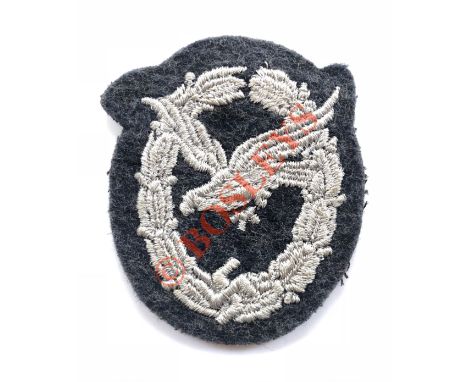 German Third Reich WW2 Luftwaffe Air Gunner cloth breast badge. A good flat embroidered example for wear on the flight jacket